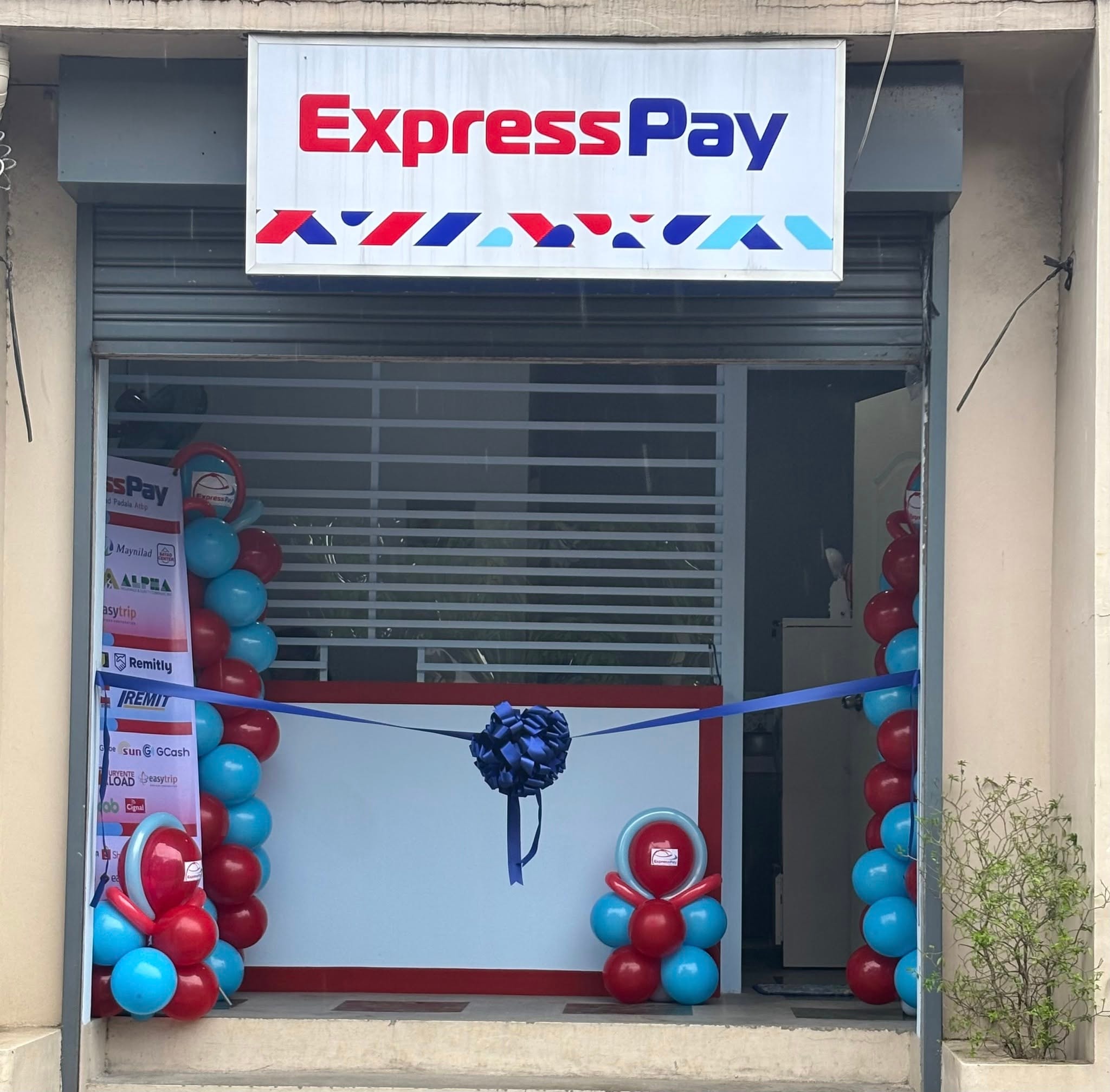 ExpressPay branch opening celebration with balloons